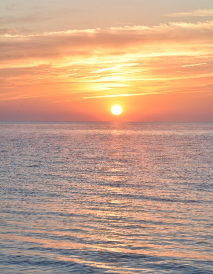 Abstract sunrise over calm water for morning routine